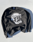 Black sweatshirt with graphic design on a light gray background